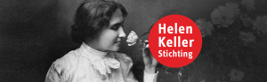 Hellen Keller ruikt aan roos